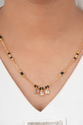 Dainty Polished Mangalsutra by Temple Dollar - featherlight pendant on a black-bead chain