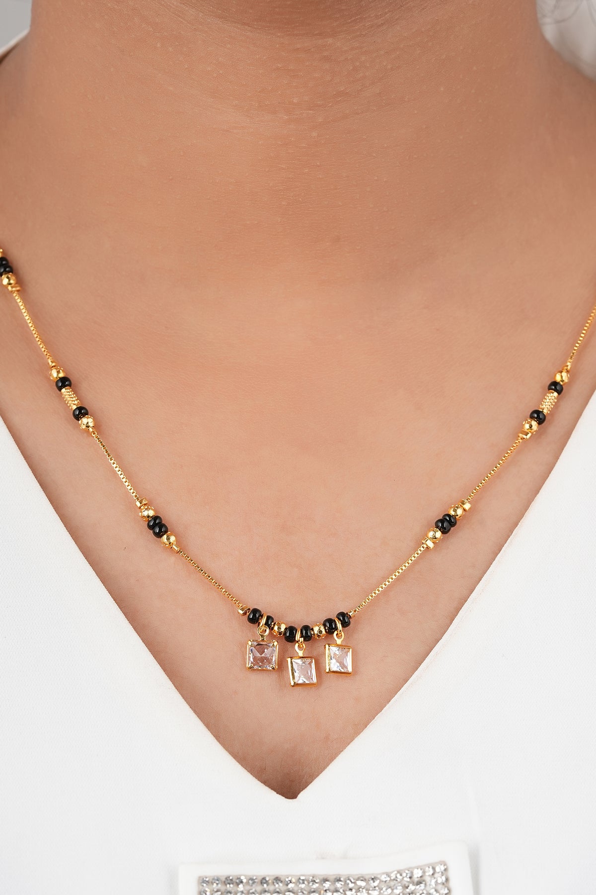 Dainty Polished Mangalsutra by Temple Dollar - featherlight pendant on a black-bead chain
