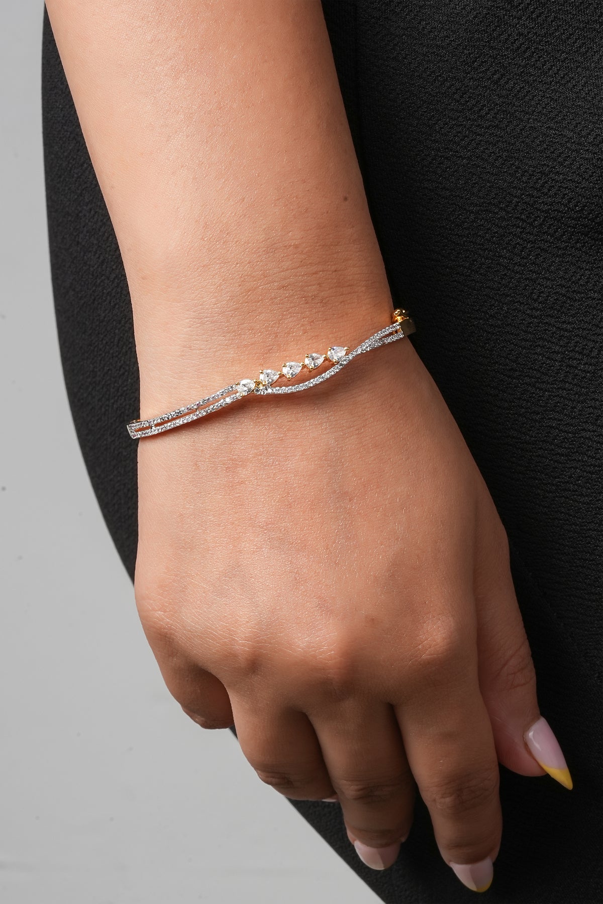 Elegant Gold & Diamond Twist Bangle Bracelet