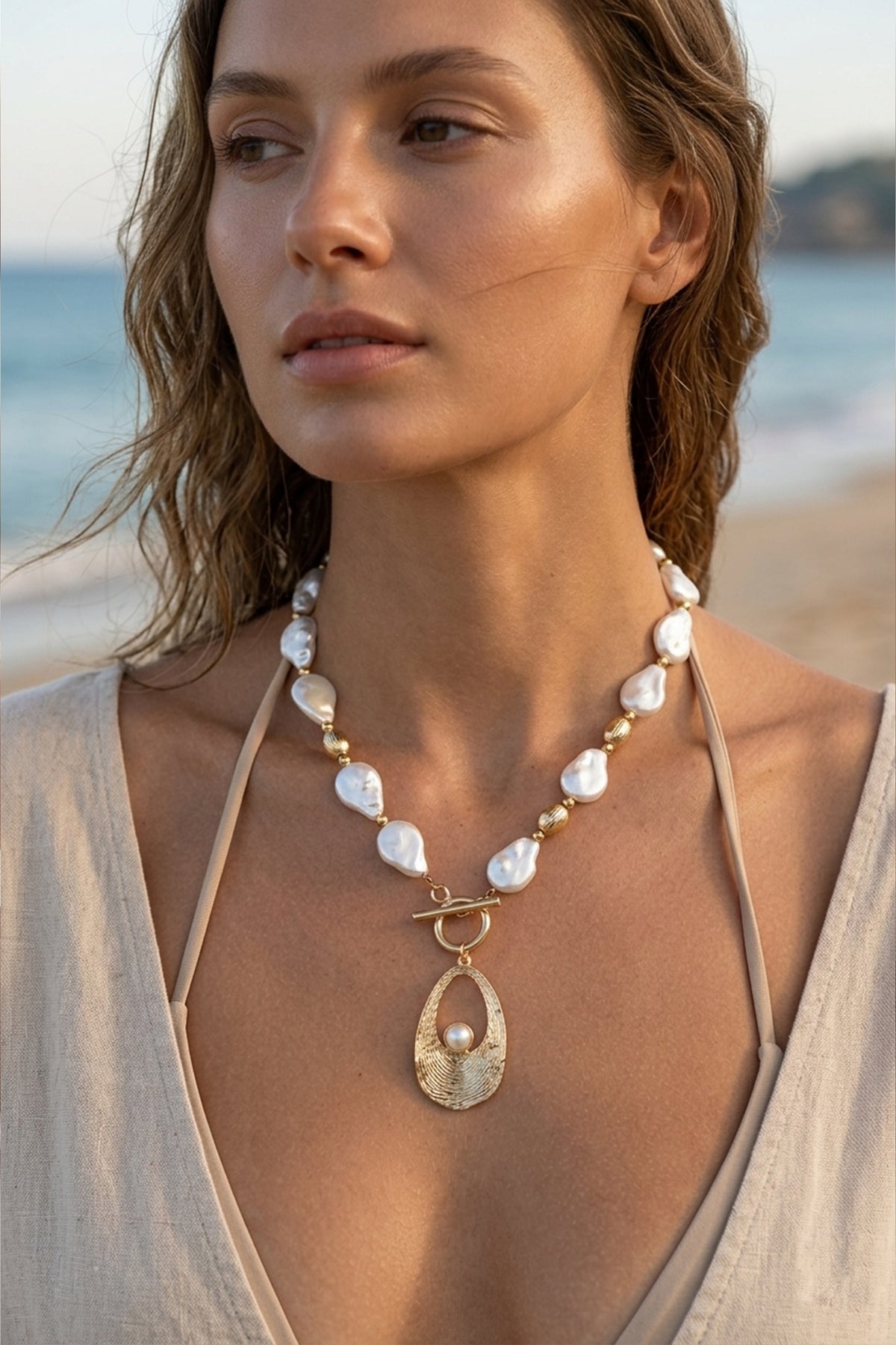 Artisan Gold-tone Toggle Necklace Featuring Baroque Pearls and Inset Detail