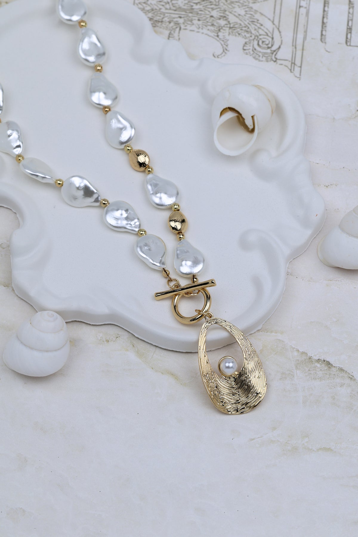 Artisan Gold-tone Toggle Necklace Featuring Baroque Pearls and Inset Detail