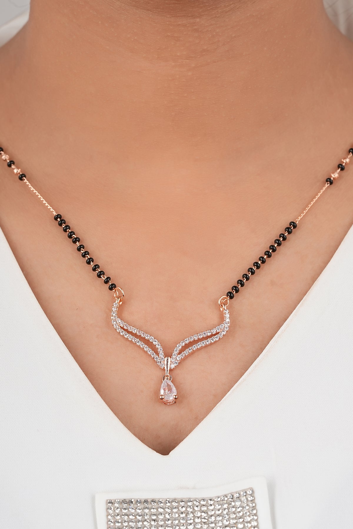 Ethereal Rose-Toned Mangalsutra by Temple Dollar - delicate pendant with gentle CZ shimmer