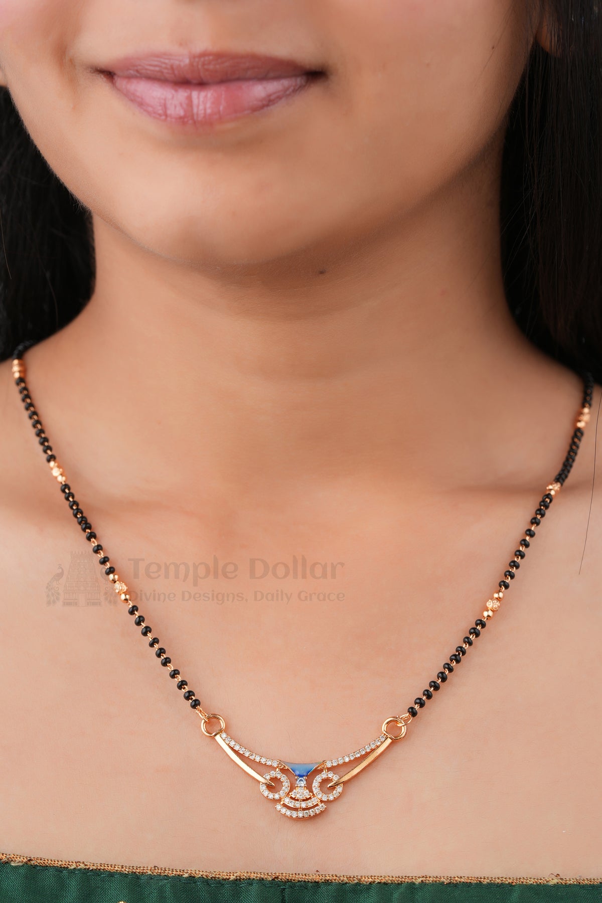 Elegant Blue Swirl Mangalsutra by Temple Dollar - swirl pendant with a blue enamel centre