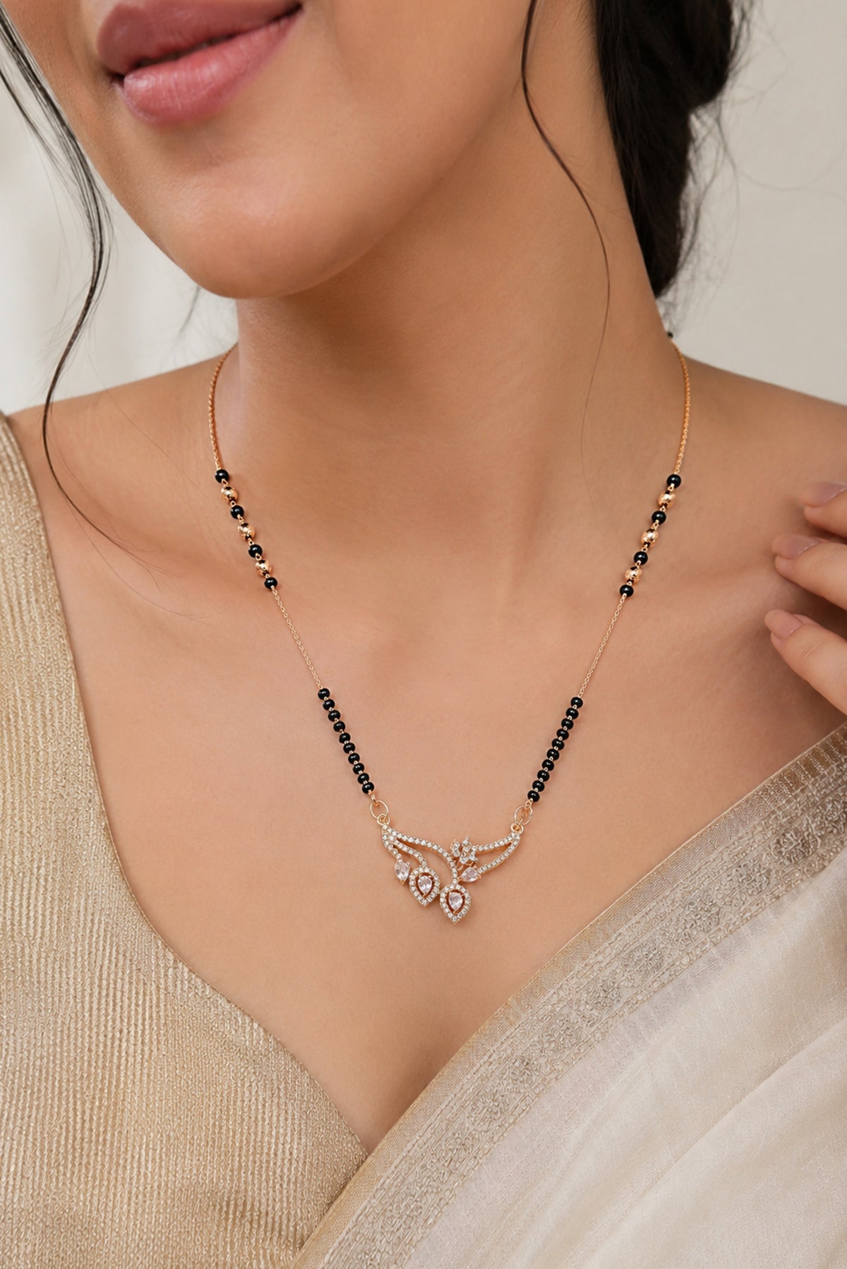 The Bloom Asymmetrical Rose-Toned Mangalsutra by Temple Dollar - asymmetrical vine with floral motifs