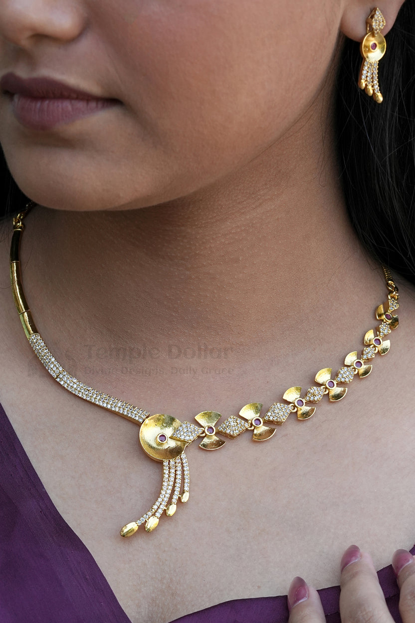 Traditional South Indian Matte Gold Jewelry Set | Antique Finish Floral and Geometric Necklace & Earrings with Ruby CZ Stones.